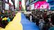 Demonstrators hold a Ukrainian flag as they protest in support of Ukraine, in Times Square New York, on February 24, 2022 Demonstrators hold a Ukrainian flag as they protest in support of Ukraine, in Times Square New York, on February 24, 2022