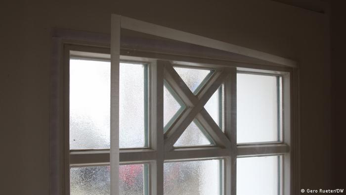 A window with an extra sheet of transparent plexiglass