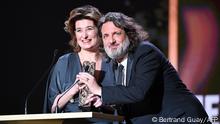 French film producers Olivier Delbosc (R) and Sidonie Dumas receive the Best Feature Film award for Illusions Perdues on behalf of French film director Xavier Giannoli during the 47th edition of the Cesar Film Awards ceremony at the Olympia venue in Paris on February 25, 2022. (Photo by BERTRAND GUAY / AFP)
