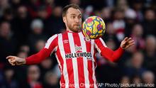 Brentford's Christian Eriksen in action, during the English Premier League soccer match between Brentford and Newcastle United at the Brentford Community Stadium, London, Saturday Feb. 26, 2022. (Aaron Chown/PA via AP)