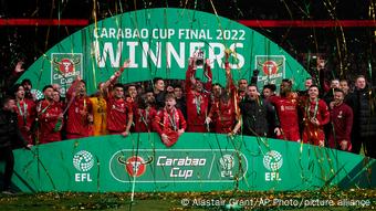 Liverpool players celebrate winning the League Cup