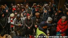PRZEMYSL, POLAND - FEBRUARY 27: People wait to cross the passport control after arriving in a train from Kiev at the Przemysl main train station on February 27, 2022 in Przemysl, Poland. According to the Polish border guard latest report ,more than 213, 000 people have crossed the border into Poland from Ukraine in the first four days of the Russian invasion. The Ukrainian government issued order to stop 18-60 year-old men legible for military conscription from crossing borders. On February 24, 2022 Russia began a large-scale attack on Ukraine, with Russian troops invading the country from the north, east and south, accompanied by air strikes and shelling. (Photo by Omar Marques/Getty Images)