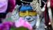 A reveller is made up in the Ukrainian colors during a peace march replacing the traditional carnival street parade in Cologne A reveller is made up in the Ukrainian colors during a peace march replacing the traditional carnival street parade in Cologne