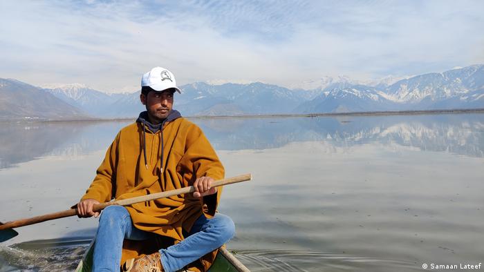 Daseer Dar rows his boat at Lake Wular