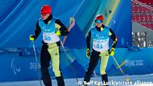 Linn Kazmaier (r) following her guide Florian Baumann at a training session in Beijing