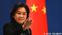 Chinese Foreign Ministry spokesperson Hua Chunying gestures during the daily Press conference at the Foreign Ministry in Beijing on February 24, 2022. (Photo by Noel Celis / AFP)