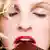 Blonde Frau mit geschlossenen Augen lässt Schokolade auf der Zunge zergehen 5355448 Paul Schwarzl 2007
