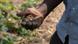 A man holding dirt in his hands A man holding dirt in his hands