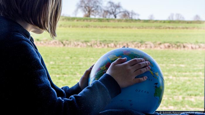 Child with a globe