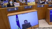 Ukrainian President Volodymyr Zelenskiy addresses the European Parliament special session, from a screen, to debate its response to the Russian invasion of Ukraine, in Brussels, Belgium March 1, 2022. REUTERS/Yves Herman
