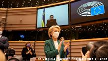 01.03.2022
European Commission President Ursula von der Leyen applauds after an address by Ukraine's President Volodymyr Zelenskyy, via video link, during an extraordinary session on Ukraine at the European Parliament in Brussels, Tuesday, March 1, 2022. The European Union's legislature meets in an extraordinary session to assess the war in Ukraine and condemn the invasion of Russia. EU Commission President Ursula von der Leyen and Council President Charles Michel will be among the speakers. (AP Photo/Virginia Mayo)