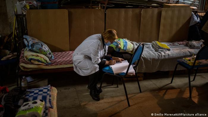 A nurse takes notes in the cellar of Okhmadet children's hospital 