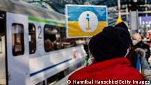 BERLIN, GERMANY - MARCH 01: Volunteers wait for refugees from the Ukraine arriving at the main train station on March 1, 2022 in Berlin, Germany. Governments around the world are still struggling to evacuate their citizens caught between Russia's armed invasion and the mounting humanitarian crisis as Ukrainians flee to neighbouring countries. Russia's large-scale invasion of Ukraine started on February 24, 2022, and although the capital was quieter overnight, Russian forces continued to mass outside the city. Ukrainian forces waged battle to hold other major cities. (Photo by Hannibal Hanschke/Getty Images)