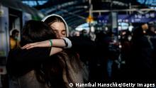 BERLIN, GERMANY - MARCH 01: Two women hug each other deeply after refugees from the Ukraine arrive at the main train station on March 1, 2022 in Berlin, Germany. Governments around the world are still struggling to evacuate their citizens caught between Russia's armed invasion and the mounting humanitarian crisis as Ukrainians flee to neighbouring countries. Russia's large-scale invasion of Ukraine started on February 24, 2022, and although the capital was quieter overnight, Russian forces continued to mass outside the city. Ukrainian forces waged battle to hold other major cities. (Photo by Hannibal Hanschke/Getty Images)