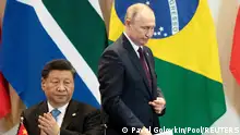 FILE PHOTO: China's President Xi Jinping, left, and Russia's President Vladimir Putin during the BRICS emerging economies meeting in Brasilia, Brazil November 14, 2019. Pavel Golovkin/Pool via REUTERS/File Photo