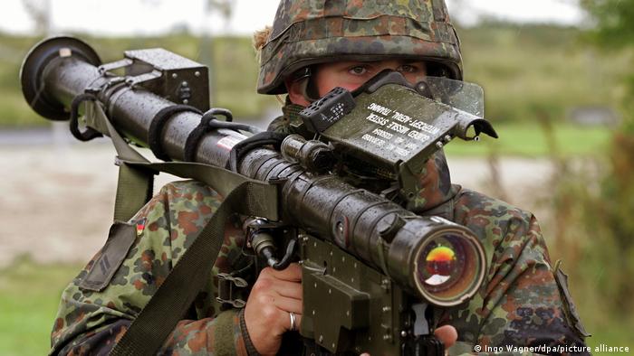 A German soldier equipped with an anti-aircraft missile system