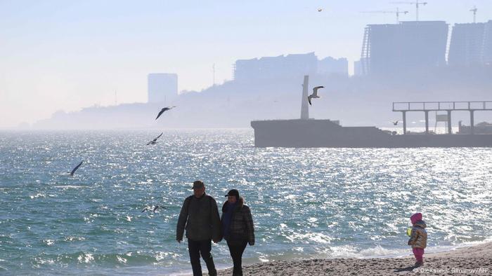 People walks on a beach in the Black Sea of Odessa