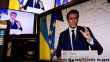 A picture of monitors taken in a media control room in Paris on March 2, 2022, shows French President Emmanuel Macron speaking from the Elysee Palace during a televised address on the general situation seven days after Russia launched a military invasion on Ukraine. (Photo by Ludovic MARIN / AFP) (Photo by LUDOVIC MARIN/AFP via Getty Images)