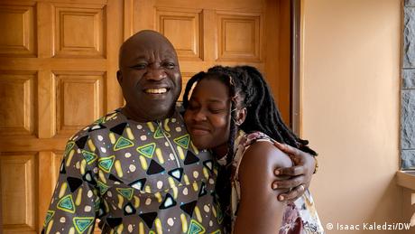 Princilla Adjar gets a hug from her father