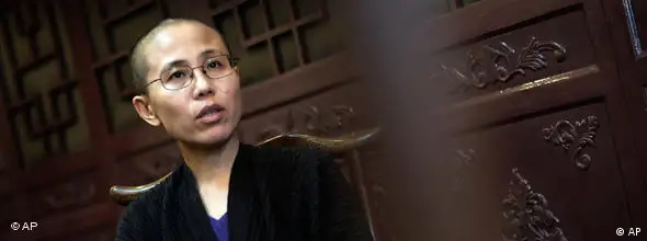 FILE -- In this Sept. 28, 2010 file photo, Liu Xia, wife of Chinese dissident Liu Xiaobo, speaks during an interview in Beijing, China. Liu Xia, the wife of Nobel Peace Prize winner Liu Xiaobo, said in a Twitter message that she had been under house arrest since Friday Oct. 8, 2010. (AP Photo/Andy Wong/file)