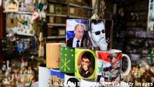 Objects with images of Syrian President Bashar al-Assad, Russian President Vladimir Putin and head of the Lebanese Shiite movement Hezbollah Hassan Nasrallah, are displayed in a souvenir shop in the old quarter of the Syrian capital Damascus, on February 27, 2022. - Damascus is a staunch ally of Moscow which intervened in the Syrian civil war in 2015 by launching air strikes to support the Assad regime's struggling forces (Photo by LOUAI BESHARA / AFP) (Photo by LOUAI BESHARA/AFP via Getty Images)