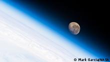 Text: The waning gibbous Moon is pictured above the Earth's horizon as the International Space Station orbited 272 miles above the Atlantic Ocean off the coast of southern Argentina.
Credit: NASA/Mark Garcia
