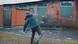 A man throws a Molotov cocktail at a brick wall A man throws a Molotov cocktail at a brick wall
