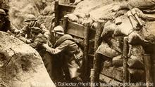 French soldiers raiding a German trench, First World War, 1914-1918, (1933). 'French troops making a daylight raid on the German trenches in search of prisoners for information purposes'. From The Pageant of the Century. [Odhams Press Ltd, 1933] (The Print Collector/Heritage Images)