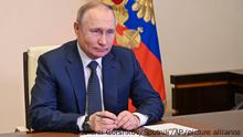 Russian President Vladimir Putin takes part in the launch of a new ferry via a conference call at the Novo-Ogaryovo residence outside Moscow Moscow, Russia, Friday, March 4, 2022. (Andrei Gorshkov, Sputnik, Kremlin Pool Photo via AP)