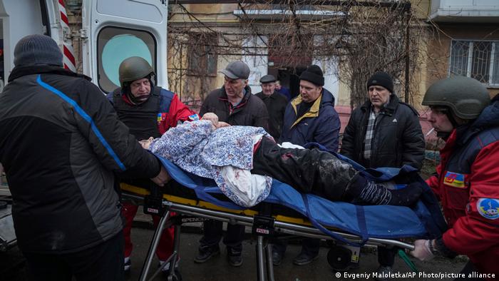 Paramedics transport and injured person in Mariupol