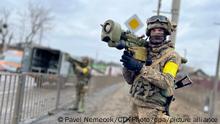 Armed Ukrainian soldiers pose with missiles in Kyiv, Ukraine, during the Russian invasion, as Russia invaded Ukraine on February 24, pictured on March 5, 2022. (CTK Photo/Pavel Nemecek)