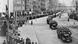 Nazi soldiers ride into Amsterdam on large trucks as people line the streets. Nazi soldiers ride into Amsterdam on large trucks as people line the streets.