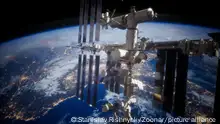 A view of the Earth and a spaceship. International space station is orbiting the Earth, Elements furnished by NASA.