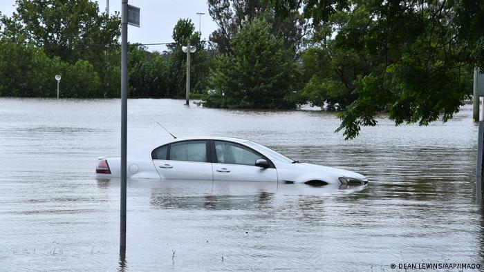 A white car floats in the water in south-west Sydney