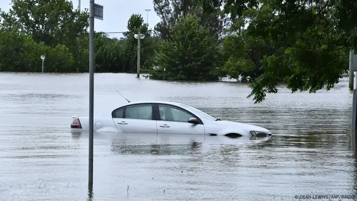 A white car floats in water in southwestern Sydney