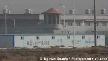 In this Monday, Dec. 3, 2018, photo, a guard tower and barbed wire fences are seen around a facility in the Kunshan Industrial Park in Artux in western China's Xinjiang region. This is one of a growing number of internment camps in the Xinjiang region, where by some estimates 1 million Muslims are detained, forced to give up their language and their religion and subject to political indoctrination. Now, the Chinese government is also forcing some detainees to work in manufacturing and food industries. Some of them are within the internment camps; others are privately owned, state-subsidized factories where detainees are sent once they are released. (AP Photo/Ng Han Guan)