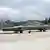 Two MIG-29 planes sit on the runway