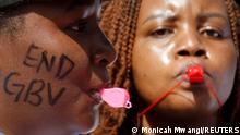 Members of the civil society blow whistles as they demonstrate against gender-based violence to mark International Women's Day in downtown Nairobi, Kenya, March 8, 2022. REUTERS/Monicah Mwangi