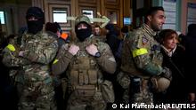 Ben grant and other foreign fighters from the UK pose for a picture as they are ready to depart towards the front line in the east of Ukraine following the Russian invasion, at the main train station in Lviv, Ukraine, March 5, 2022. Picture taken March 5, 2022. REUTERS/Kai Pfaffenbach