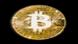Foto del logo de Bitcoin sobre una moneda dorada. Foto del logo de Bitcoin sobre una moneda dorada.