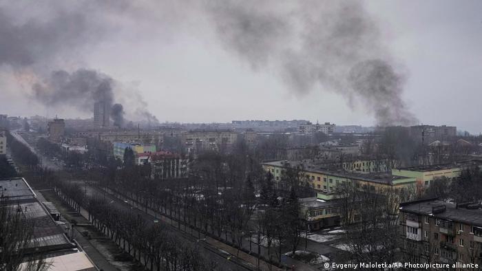 Smoke billowing above buildings in Ukraine