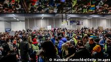 03.03.22 *** BERLIN, GERMANY - MARCH 02: Locals offer accommodation for People fleeing war-torn Ukraine at Hauptbahnhof main railway station on March 2, 2022 in Berlin, Germany. Hundreds of thousands of people, mainly Ukrainian women and children as well as foreigners living or working in Ukraine, have fled the country as the current Russian military invasion continues to inflict growing casualties on the civilian population. (Photo by Hannibal Hanschke/Getty Images)