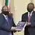 Judge Raymond Zondo hands the first part of the report of the Judicial Commission of Inquiry into Allegations of State Capture to South Africa's President Cyril Ramaphosa