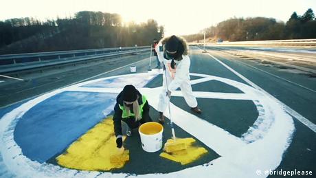 art installation blue-yellow peace sign on street | #bridgeplease | solidaity with Ukraine
