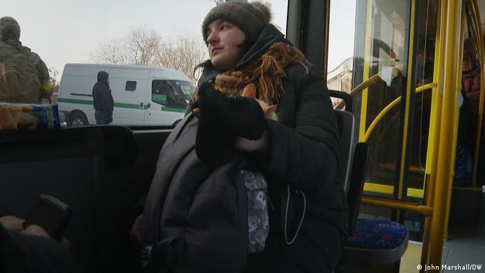 A Ukrainian woman with her cat in a bus