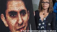 THE CANADIAN PRESS 2015-06-16. Ensaf Haidar, wife of Raif Badawi, stands next to a poster of a book of articles written by the imprisoned Saudi blogger, Tuesday, June 16, 2015 in Montreal. THE CANADIAN PRESS/Paul Chiasson URN:48963414