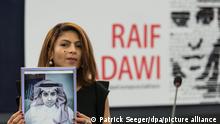 epa05070925 Ensaf Haidar, wife of jailed Saudi blogger Raif Badawi, holds a picture of her husband in the European Parliament in Strasbourg, France, 16 December 2015. Raif Badawi, who is serving a prison term in Saudi Arabia for allegedly insulting Islam, was awarded the European Parliament's Sakharov Prize for Freedom of Thought on 16 December, due to exceptional courage which had earned him 'one of his country's most gruesome punishments,' parliament President Martin Schulz has said. EPA/PATRICK SEEGER +++ dpa-Bildfunk +++