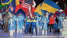 Athletes wave their national flags during the Closing Ceremony of the Paralympic Winter Games Beijing 2022. at National Stadium on March 13, 2022.More than 560 athletes from 46 countries and regions participated in the games as Ukraine war looms worse.  ( The Yomiuri Shimbun via AP Images )  ( The Yomiuri Shimbun via AP Images )