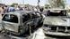 Iraqi men inspect the scene of a car bomb attack near a government building in Kirkuk, northern Iraq.