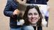 A picture of Nazanin Zaghari-Ratcliffe being held by her husband and daughter A picture of Nazanin Zaghari-Ratcliffe being held by her husband and daughter